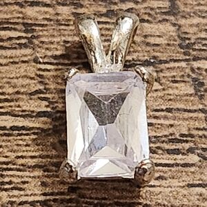 Elegant Silvertone Pendant with Clear Glass